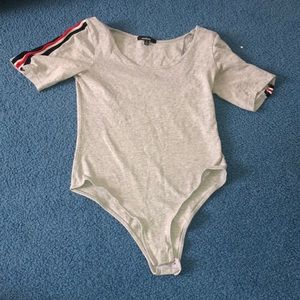 This is a one piece tommy like striped size small